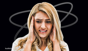 woman having a vestibular attack experiencing dizziness and occulomotor issues